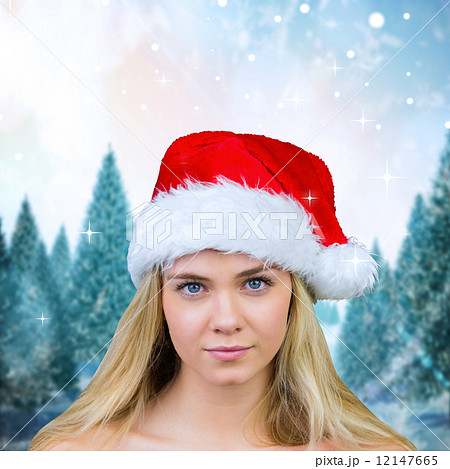 Composite image of blonde with bare shoulders in santa hat Composite image of blonde with bare shoulders in santa hat 12147665