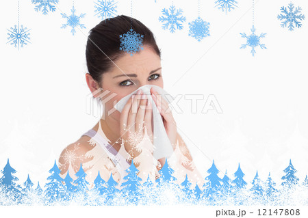 Composite image of sad woman blowing her nose 12147808