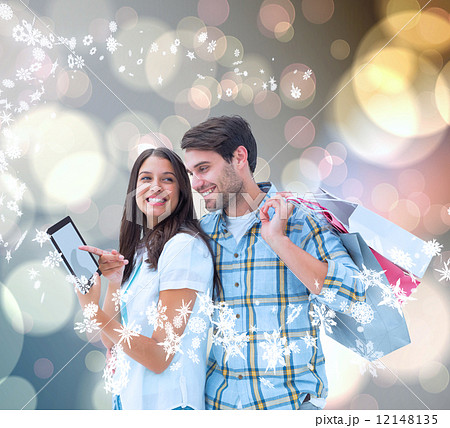 Composite image of happy couple with shopping bags Composite image of happy couple with shopping bags 12148135