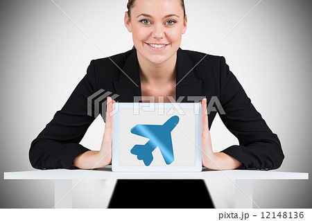 Composite image of businesswoman showing tablet pc Composite image of businesswoman showing tablet pc 12148136