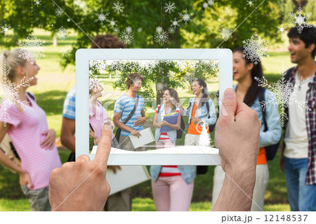 Composite image of hand holding tablet pc Composite image of hand holding tablet pc 12148537