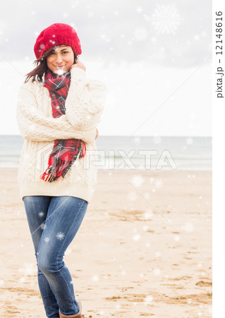 Composite image of cute smiling woman in stylish warm clothing a 12148616