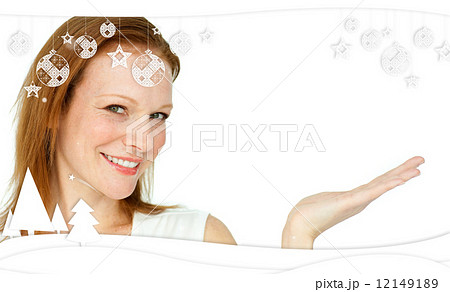 Composite image of confident businesswoman promoting 12149189