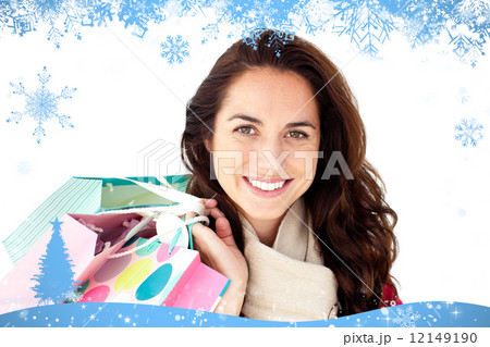 Radiant woman wearing a scarf and holding shopping bags 12149190
