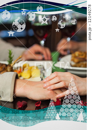 Close up on couple holding hands during dinner Close up on couple holding hands during dinner 12149278