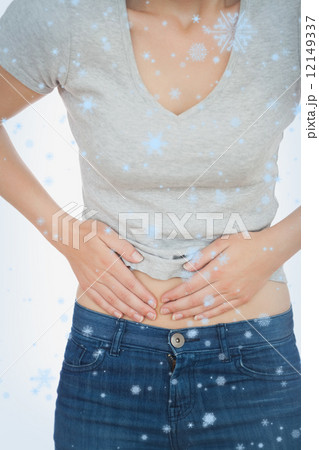 Composite image of woman with abdominal pain Composite image of woman with abdominal pain 12149337