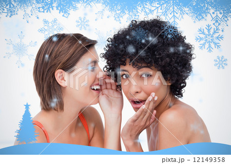 Teenage girl whispering a secret to a surprised friend Teenage girl whispering a secret to a surprised friend 12149358