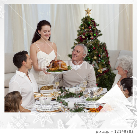 Woman showing turkey to her family for christmas Woman showing turkey to her family for christmas 12149383