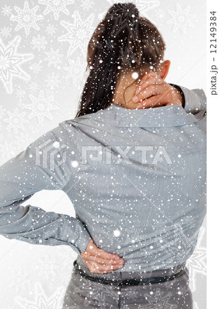 Portrait of the painful back of a young businesswoman Portrait of the painful back of a young businesswoman 12149384
