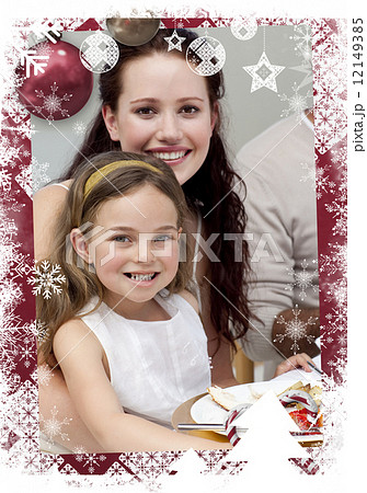 Mother and daughter having dinner with their family Mother and daughter having dinner with their family 12149385