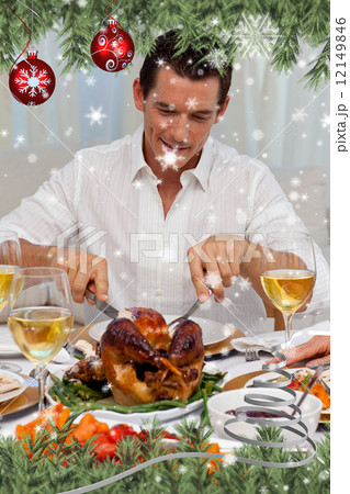 Composite image of attractive man eating turkey in christmas din 12149846