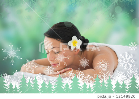Beautiful brunette relaxing on massage table 12149920