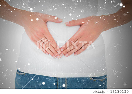 Mid section of a casual woman with stomach pain 12150139