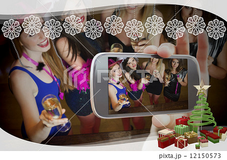 Hand holding smartphone showing photo Hand holding smartphone showing photo 12150573
