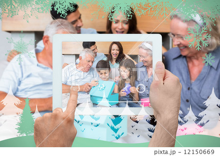 Composite image of hand holding tablet pc Composite image of hand holding tablet pc 12150669