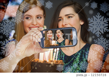 Hand holding smartphone showing photo 12150728