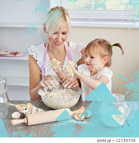 Simper woman baking cookies with her daughter 12150736