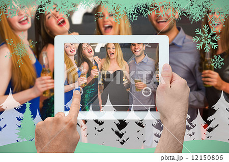 Composite image of hand holding tablet pc 12150806