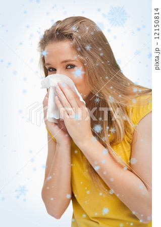 Portrait of a blond woman blowing Portrait of a blond woman blowing 12150814