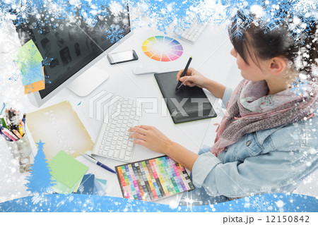 Artist drawing something on graphic tablet at office Artist drawing something on graphic tablet at office 12150842