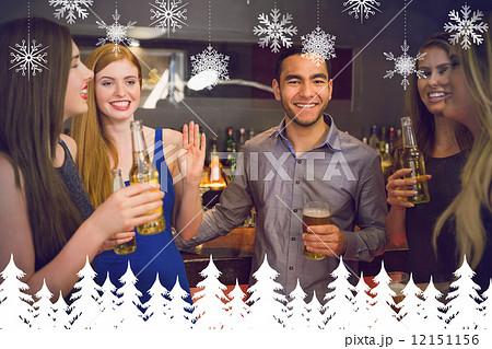 Composite image of happy friends holding beers 12151156