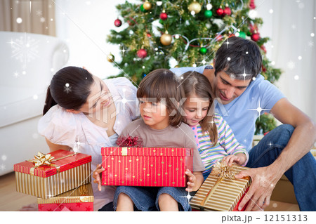 Composite image of family christmas portrait Composite image of family christmas portrait 12151313