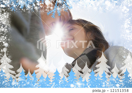 Composite image of cute couple hugging in the park Composite image of cute couple hugging in the park 12151358