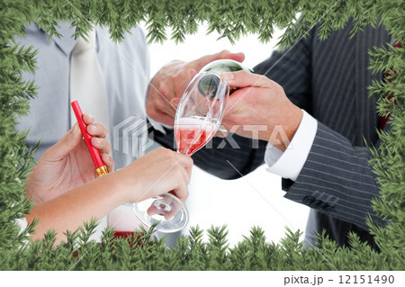 Close up of two colleague drinking champagne to celebrate christ Close up of two colleague drinking champagne to celebrate christ 12151490