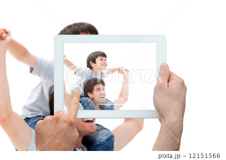 Composite image of hand holding tablet pc 12151566
