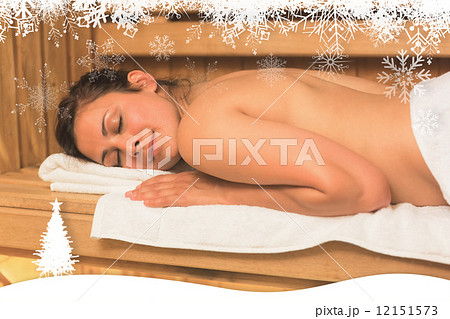 Happy brunette lying down in a sauna Happy brunette lying down in a sauna 12151573
