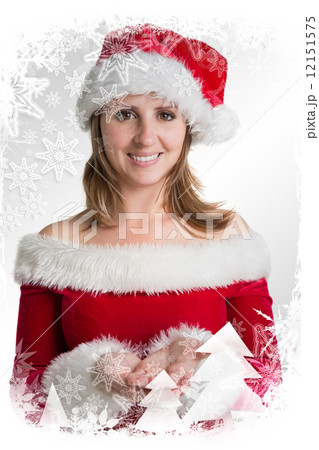 Pretty woman in santa costume presenting your product 12151575