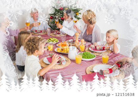 Composite image of adults raising their glasses at christmas din 12151638