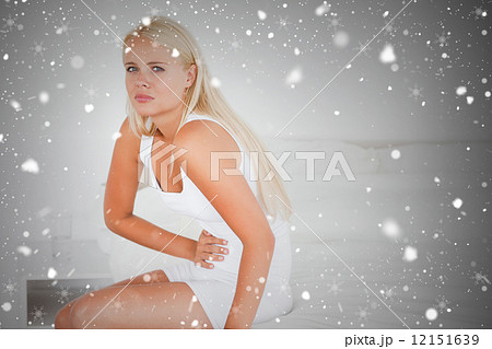 Composite image of sick woman having a stomach ache Composite image of sick woman having a stomach ache 12151639