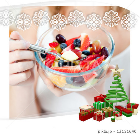 Close up of a woman eating a fruit salad Close up of a woman eating a fruit salad 12151640