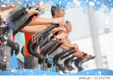 Fit people working out at spinning class 12151759