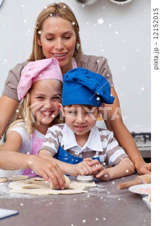 Mother helping her children baking 12152015