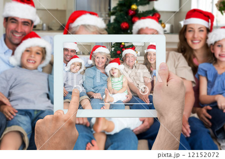 Composite image of hand holding tablet pc Composite image of hand holding tablet pc 12152072