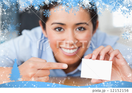 Composite image of attractive woman showing her visiting card 12152156