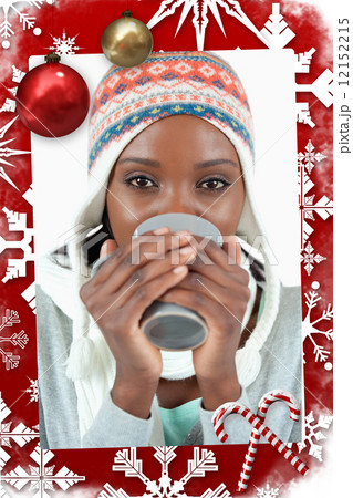 Composite image of young woman enjoying tea in the cold 12152215