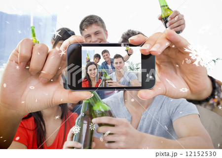 Hand holding smartphone showing photo Hand holding smartphone showing photo 12152530
