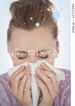 Composite image of woman blowing nose 12152566