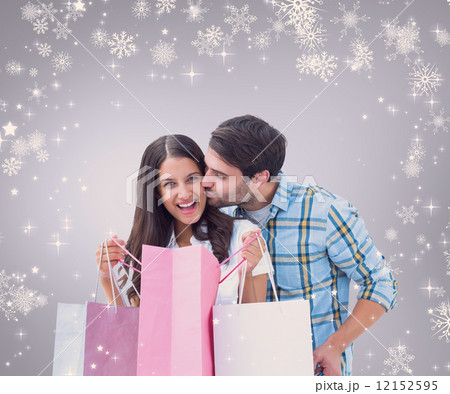 Composite image of happy couple with shopping bags Composite image of happy couple with shopping bags 12152595