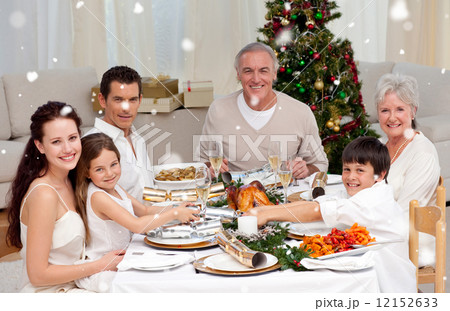 Composite image of children pulling a christmas cracker at home 12152633