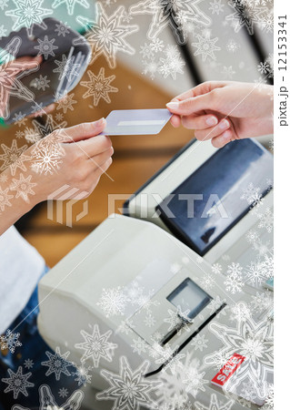Close up of a teen woman paying with her credit card Close up of a teen woman paying with her credit card 12153341