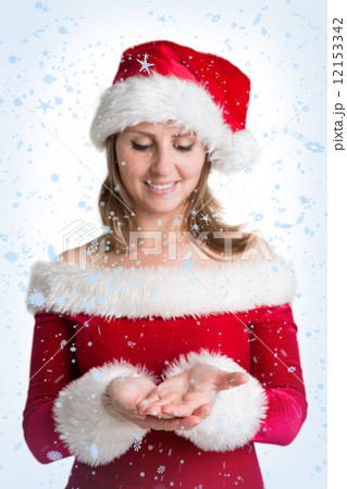 Pretty woman in santa costume presenting your product Pretty woman in santa costume presenting your product 12153342