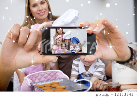 Hand holding smartphone showing photo Hand holding smartphone showing photo 12153343