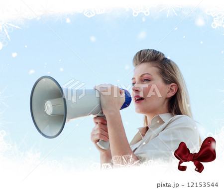 Blonde businesswoman shouting through megaphone 12153544