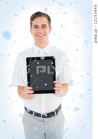 Geeky businessman showing his tablet pc 12153649