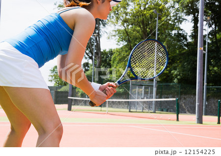 Tennis player standing on court Tennis player standing on court 12154225