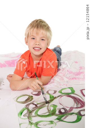 Happy little boy painting on the floor Happy little boy painting on the floor 12154864